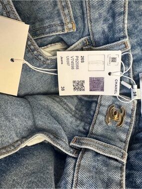 Authentic CHANEL Light Blue High-Rise Denim Jeans with Gold CC Button